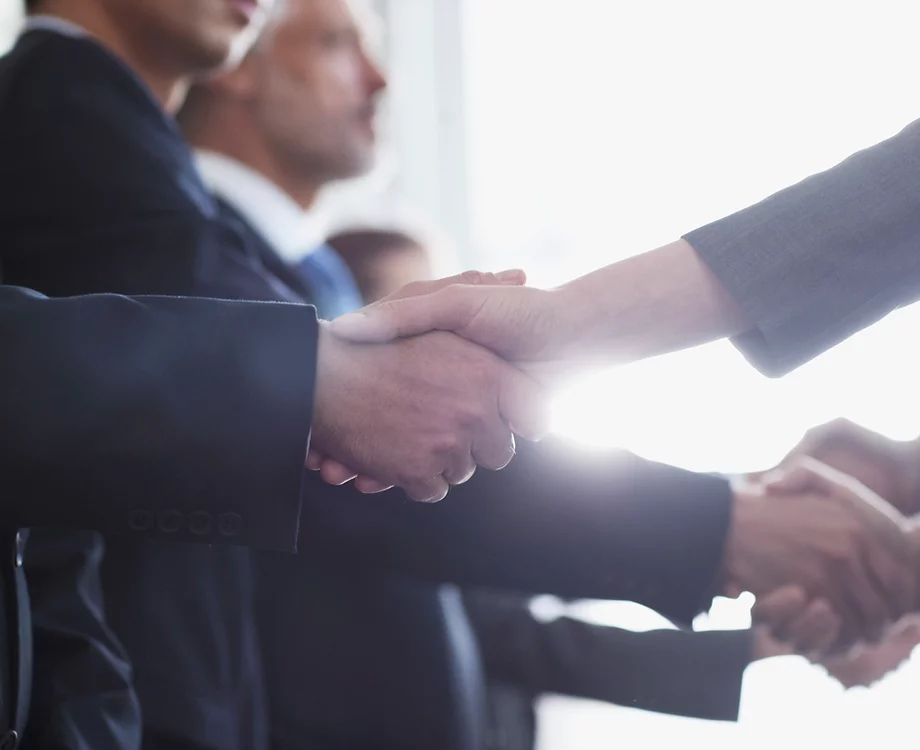 Homeowner and GHG Property Solutions shaking hands